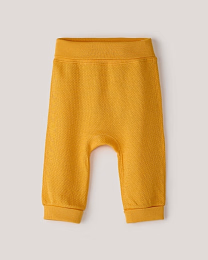 Набор штанов из фактурной ткани горчичного и бежевого цвета от бренда Anna Leon