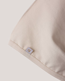 Набор чепчиков зеленого и молочного цвета от бренда Anna Leon