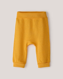 Набор штанов из фактурной ткани горчичного и бежевого цвета от бренда Anna Leon