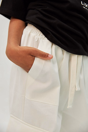 Брюки KARGO коттон молочного цвета от бренда Liqlo