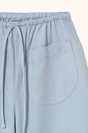 Штаны с подворотом гоубого цвета от бренда Tinycottons