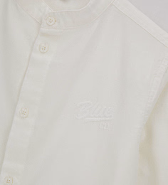 Рубашка молочного цвета с воротником-стойка от бренда Original Marines