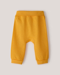 Набор штанов из фактурной ткани горчичного и бежевого цвета от бренда Anna Leon