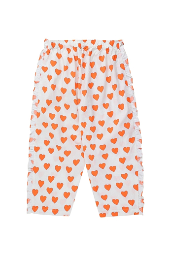 Брюки с оранжевыми сердечками от бренда Tinycottons