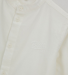 Рубашка молочного цвета с воротником-стойка от бренда Original Marines