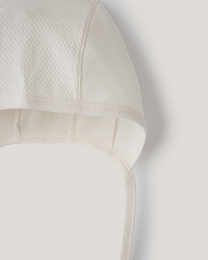 Набор чепчиков зеленого и белого цвета от бренда Anna Leon