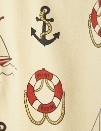 Легинсы бежевые с морским принтом от бренда Mini Rodini