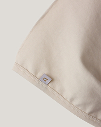 Набор чепчиков зеленого и молочного цвета от бренда Anna Leon